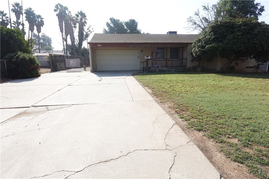 This is a great opportunity to purchase a large lot home central to Riverside which has a plethora of amenities. The home offers 2 cozy bedrooms and two baths, a quaint dinning room and living room that is separated by original arch architect features. A two way driveway that wraps around the entire property along with RV parking on both sides of lot. Property offers several different RV clean out stations as well! Entertain or relax in the back yard with a large in ground pool. An extra large covered drive through workshop fitted with additional power is available and is currently set up as a heavy duty workshop which measures approx. 48x33 Previous plans were drawn to add an additional bathroom and living area. Backyard has an additional covered patio. Property has no backyard neighbors and offers a lot of space.  Seller has previous approved plans to add an additional bedroom and bath. Sewer line has already been tied in. Close in proximity to the 91/60/60/215/15 freeways.