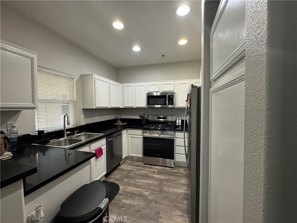 This beautiful condo is in a GATED community of Verona and in AWARD WINNING MURRIETA SCHOOL DISTRICT. This community has a gym, BBQ's, Pool and Spa! Unit comes with private one car garage with remote and plenty of visitor parking space. Beautifully refurbished last year with NEW paint, LVP Flooring, wide baseboards, water heater. Spacious kitchen was also redone with Quartz countertop, and new stainless-steel stove, microwave, and dishwasher and have plenty of cabinets. Large Living /dining room have a fireplace and sliding doors that leads you to a private balcony. Refrigerator, washer and dryer are included. Master Bedroom have walking closet. The property is located with quick excess to 215 and 15 FWYs. Close to Shopping, the Promenade Mall, restaurants, beautiful Wine country, old town Temecula, Historic Murrieta and beautiful La Cresta. Low HOA and Low taxes make this very attractive investment.