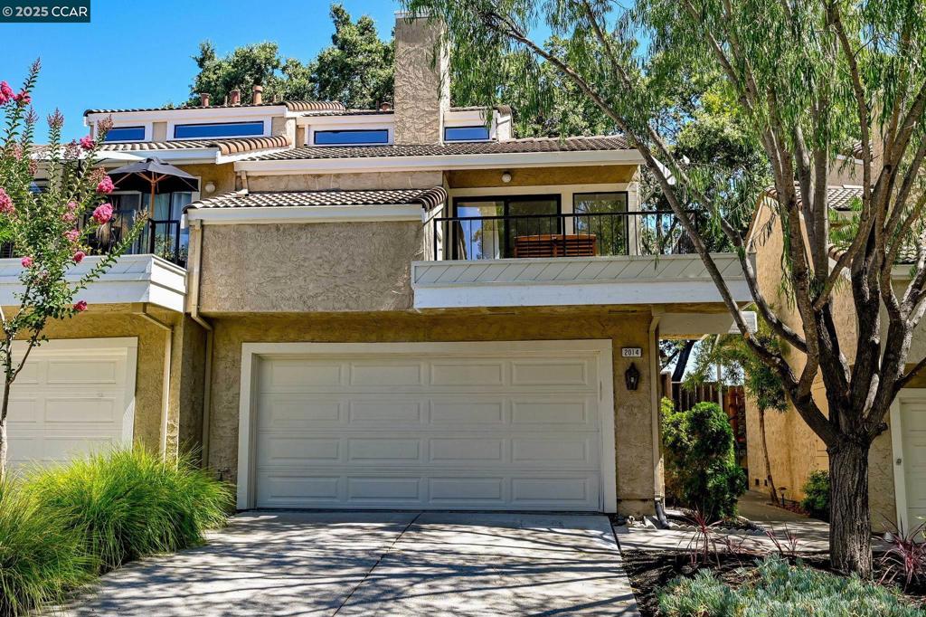Bring your tools and your own design style and create the home of your dreams in this minimum work cosmetic fixer. Perfectly nestled on the Pleasant Hill Border in the Lost Lake garden community, this charming duet-style townhome is just steps from Hidden Lakes Park and miles of scenic hiking trails. Enjoy two spacious primary bedrooms with walk in-closets, and ensuites. Multiple private outdoor retreats include a tranquil treetop deck off the main living area—perfect for dining al fresco or watching the sunset—and a tropical-inspired garden deck accessed from the spacious ground floor primary suite, complete with a rock-lined path and lush blooms, ideal for quiet mornings or winding down at the end of the day. The light and bright living and dining areas feature a cozy fireplace and great flow for entertaining. Additional highlights include a two-car attached garage, fresh paint, new carpet, updated lighting, ample storage, a community pool, and an ideal location near Hidden Lakes Park, Diablo Valley College, BART, shopping, dining, and top-rated Mt Diablo schools—with easy access to Pleasant Hill, Downtown Martinez, Lafayette and Walnut Creek. A rare find at an affordable price.