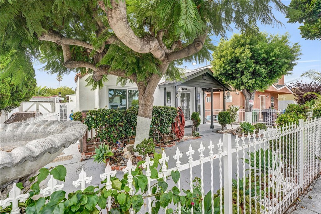 A Heartwarming Home in the Heart of It All! Step into comfort, charm, and convenience with this beautifully updated 4-bedroom, 3-bathroom gated home, ready to accommodate many lifestyles and life chapters. You’ll be welcomed by a cozy front porch perfect for morning greetings or evening conversations. Fresh interior paint brings a bright energy throughout, while the open floor plan between the living and kitchen areas creates the perfect space for connection, creativity, and comfort. The kitchen is a modern delight, outfitted with stainless-steel appliances, white cabinetry, and quartz countertops, offering both functionality and style for everyday meals or weekend gatherings. This home features four spacious bedrooms with good closet space and abundant natural light. The layout offers flexibility to use all four as sleeping retreats, or convert the fourth bedroom, featuring double glass doors opening to the covered patio, into a home office, studio, dining area, or lounge. Three full bathrooms include a primary suite oasis with an ensuite bath, relaxing tub, and glass doors to a private balcony, ideal for morning coffee or evening tea. A second bedroom also has a private ensuite, great for guests or multigenerational living. The third bath is shared between the other two rooms. Outside, enjoy Southern California’s sunshine under the expansive covered hardscape patio, perfect for BBQs, celebrations, or simply lounging with a book and a cool drink. A gated driveway provides secure parking for two vehicles, one in the garage, one on the driveway. Central air and heating keep you comfortable year-round, and there's a dedicated laundry area for your side-by-side washer and dryer. Located in a vibrant neighborhood just minutes from LAX, SpaceX, SoFi Stadium, YouTube Theater, and the upcoming Intuit Dome, with dining, shopping, and entertainment from Abbot Kinney to The Promenade at Howard Hughes Center. Enjoy easy access to Dockweiler Beach, Playa Vista, Marina Del Rey, and Manhattan Beach, plus quick freeway access to Santa Monica, Culver City, Downtown LA, and even Palm Springs, Lake Arrowhead, Big Bear, and San Diego. Whether seeking a peaceful retreat, a lively hub, or something in between, this home offers it all. Recording cameras and alarm systems are on. Schedule a tour today and see why this heartwarming house is a great place to call home!