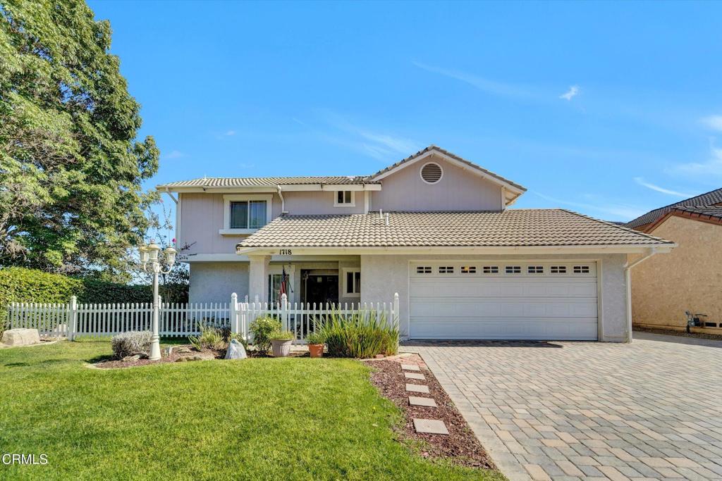 Great opportunity to own a beautifully maintained, two-story traditional home tucked into Santa Paula's peaceful Cherry Hill neighborhood. Boasting 4 bedrooms, 3 baths, and a stylish stone veneer fireplace, this home blends comfort with classic charm. Enjoy flexible living with a downstairs bedroom/den/office area, a spacious kitchen with adjacent breakfast nook, and a seamless flow upstairs with 3 additional bedrooms and 1.75 baths. Seller recently installed vinyl laminate flooring throughout the property. Your future home offers a tile roof, dual pane windows, water softer and reverse osmosis systems for your enjoyment. Ample parking is comprised of a 2 cars attached garage and beautifully finished driveway with brick pavers. Step outside to your private fenced yard and patio, perfect for relaxation or entertaining. This includes freestanding gazebo and spacious back yard. The home ensures year-round comfort with central air conditioning alongside natural gas heating. Centrally located near top-rated schools, Mupu Elementary, Bedell Middle, and Santa Paula High, and with easy access to cultural destinations such as the California Oil Museum and Art Museum, this residence offers both convenience and community. 1718 Cherry Hill Road invites you to enjoy a tranquil, small-town lifestyle enriched with history, neighborly warmth, and the promise of family memories to come.