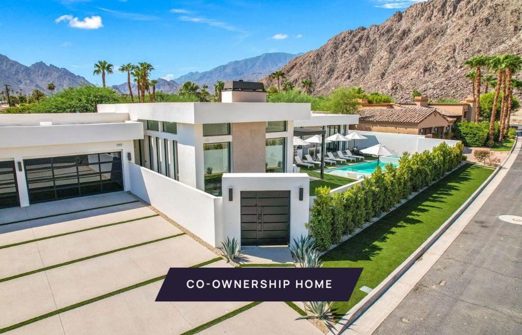 Own one-eighth of this professionally managed, turnkey home. Nestled in the mountains in the private enclave of Flores Montanas, this modern home has a walled courtyard for ultimate privacy. And for privacy inside, each of the four bedrooms has its own en suite bathroom. Enter the gate and you'll see two in-ground fire troughs placed in the artificial turf lawn, surrounded by lush landscaping. The custom glass front door leads to an open-plan living space with 14-foot ceilings, plank tile floors, Cambria quartz counters, gold-toned hardware and fixtures, and custom lighting. The home has multiple La Cantina pocket doors that open up for indoor/outdoor living. The generous zero-edge pool with custom tile work and the large Baja shelf are perfect for enjoying the mountain views. Two BBQ counters and a fire pit await just outside the primary bedroom. The primary suite features a dressing area and soaking tub. In addition to the bedrooms, the home includes a homework/media station in the hall, a butlers pantry/laundry area with barn door, a coffee bar and floating shelves. The home comes fully furnished and professionally decorated.