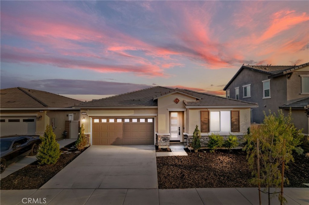 Welcome to this stunning single-story home, built in 2023 and loaded with high-end upgrades. Situated on a spacious lot with partial mountain views, this 3-bedroom, 2-bath home also features a flexible office space that can easily serve as a 4th bedroom. Inside, you'll find marble-inlaid laminate flooring, a designer accent wall, and an open-concept layout perfect for both everyday living and entertaining. The chef’s kitchen offers quartz countertops, Café stainless steel appliances, soft-close cabinetry, and a walk-in pantry. The primary suite is a true retreat with a spa-inspired bath and walk-in closet. Additional highlights include a cozy electric fireplace, dedicated laundry room, security system, pre-wired for speakers and fans, and fully paid-off solar. The backyard is a blank canvas—ready for your personal touch!
