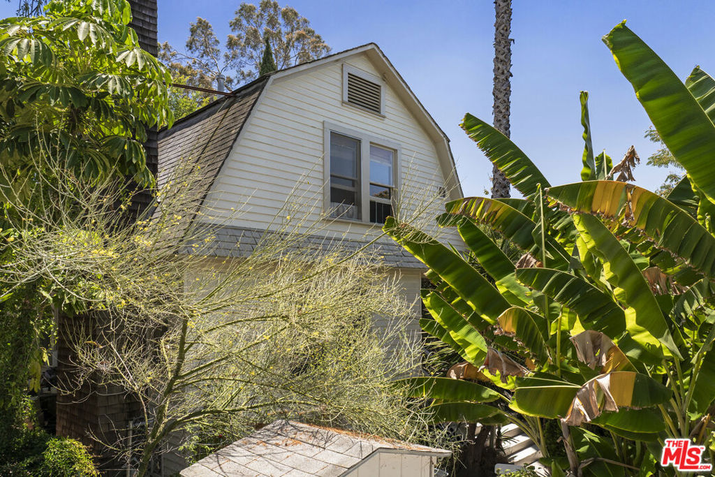 Vintage Bohemian triplex in the heart of Silver Lake, within a highly walkable neighborhood, offering 3 separate houses on a sizable lot. Originally built in 1905, this income property is a perfect opportunity for a savvy investor looking to own in one of LA's most sought after areas, half a block from vibrant Sunset Junction, with easy access to some of the best retail shops & restaurants in Silver Lake. The 2-story main house, full of original charm and character and recently renovated, offers 2 bedrooms and 1 bathroom, with natural light flooding the space, creating a warm and inviting ambiance. A beautiful antique brick fireplace anchors the living room, a cozy dining room complemented by vintage built-ins showcase the home's craftsmanship. An efficient kitchen is fully equipped and opens to a shaded backyard with a covered dining terrace, the perfect spot for morning coffee, al-fresco dining or relaxing in a peaceful setting. The primary bedroom occupies the entire top floor and includes a large sitting area, ideal for a home office or den. Two additional separate Craftsman-style 1 bed and 1 bath homes are located at the rear of the property. All 3 units are very private with their own fenced-in yard, shaded by majestic trees and lush foliage. All units are currently tenant-occupied on month-to-month leases. There is a one car detached garage at the front of the property. This fantastic Silver Lake location, just moments away from Los Feliz, Echo Park, Hollywood, Griffith Park and Downtown LA, is characterized by high demand contributing to a thriving and dynamic rental market.