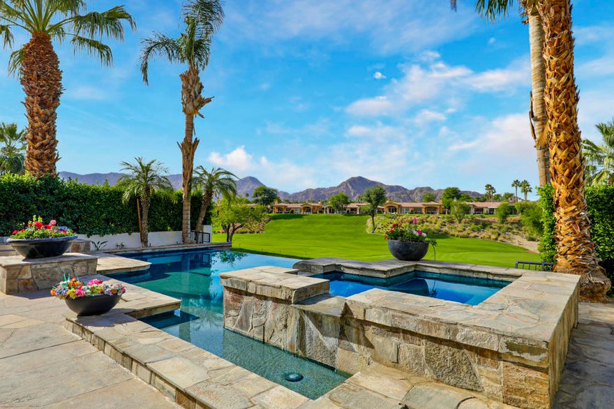 Experience the ultimate desert getaway in a beautifully appointed home that offers both comfort and spectacular scenery. Take in breathtaking panoramic views of the Santa Rosa Mountains and lush golf course from nearly every room. Relax by the stunning custom infinity pool, raised spa, and cascading waterfalls while soaking in the serene desert landscape.Designed for seamless indoor-outdoor living, the spacious step-down BBQ area is perfect for entertaining as guests swim and unwind. The poolside setting offers a tranquil space to relax, dine, or enjoy spectacular sunsets. Inside, tasteful and comfortable finishes create a welcoming retreat ideal for seasonal stays, with an open-concept layout that maximizes natural light and views. Three bedrooms plus an office provide ample space for family and friends.Guests can also enjoy access to Rancho La Quinta Clubs Olympic-sized pool,  world class tennis courts, pickleball courts, and limited golf privileges up to six times per calendar year. Come to the Desert and make this your perfect vacation home.