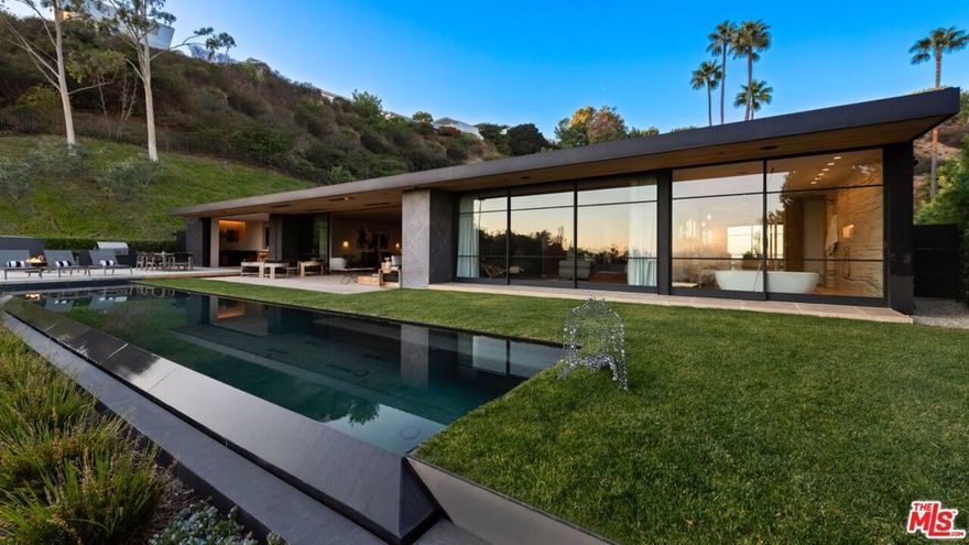 Located on one of Trousdale's most exclusive streets, behind gates at the end of a very quiet and secluded cul-de-sac. A stunning modern architectural masterpiece completely rebuilt and recently completed with incredible taste, quality, and sophistication. You are captured immediately by the stunning open rooms which all overlook panoramic city views. There's a beautiful living room, dining, den/media room, and gourmet kitchen with breakfast area. All bedrooms are beautifully appointed suites, each with en-suite baths that adorn the most luxurious lifestyle. The primary suite captures the glamorous essence of Trousdale. Custom built and crafted with the highest standard of materials and situated on an incredible gated lot with large motor court. High ceilings, walls of glass and great walls for art are at the center of this entertainer's paradise. There's a spectacular pool, spa, fire pit and barbecue complete and incredible areas to entertain. The perfect Trousdale pied-a-terre! Shown to prequalified clients.