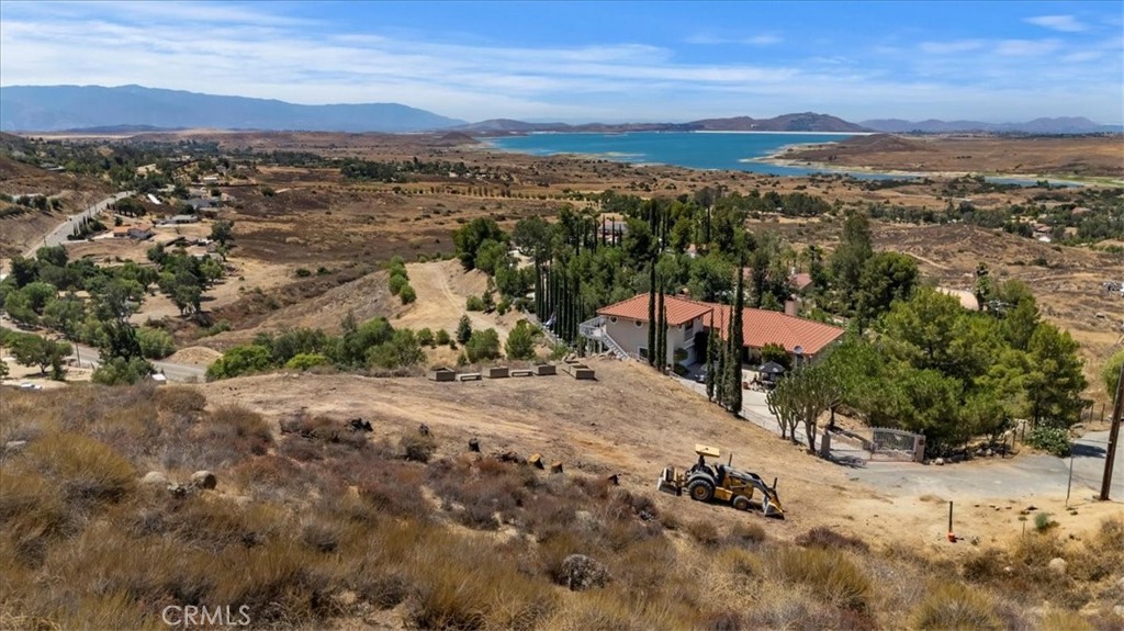 **2 ACRE LOT IN LAKE MATHEWS with MASSIVE LAKE VIEWS & WATER METER*** The 2.01 Acres has amazing Views of the Lake with plenty of room to Build your DREAM HOME, Pool, Spa, BBQ or anything you can Dream up!!! There is a fully Paid WATER METER, pad and utilities close by saving tons of money on building. This lot is surrounded by Beautiful Custom Homes and has the most Amazing Sunsets!!! Don't miss out as Lake Mathews is the best kept secret and is such a peaceful and tranquil area located on the edge of Riverside and Corona with easy access to the I-15, 91 and 215 Freeways. The best Dining and Entertainment at The Crossings and Dos Lagos in Corona. Low Tax Rate, NO HOA and Excellent Schools.