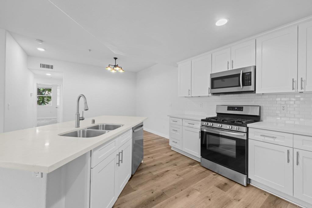 Welcome to this beautifully upgraded 3 bed, 2 bath home featuring a spacious open layout is designed for comfort and modern living.The kitchen shines with quartz countertops, shaker cabinets, backslash, 5 gas-burning stove, stainless steel appliances and a large center island with a breakfast bar and deep dual-basin sink. Enjoy seamless indoor-outdoor living on the spacious balcony—ideal for relaxing or entertaining. This light-filled home offers comfort, charm, and convenience. Located minutes from top-rated schools, shopping, dining, and scenic hiking trails. Move-in ready and ready to welcome you home!