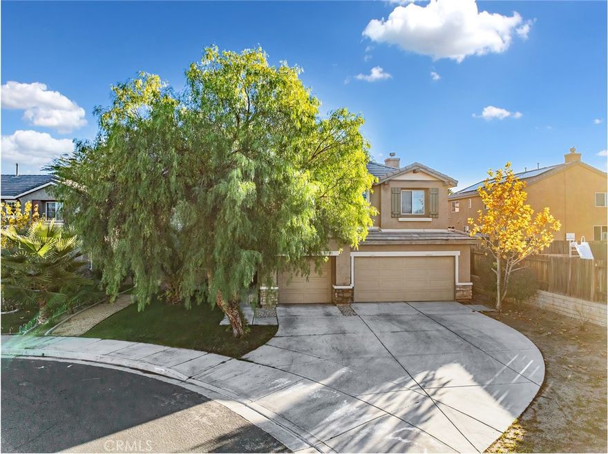 Welcome to 13802 Goldfinch Ct, a beautifully appointed home located on a quiet cul-de-sac in the heart of Victorville. Featuring PAID-OFF SOLAR, dual A/C units, and 3,480 sq. ft. of living space, this impressive two-story residence offers 5 bedrooms and 4 bathrooms on a 7,080 sq. ft. lot with an attached 3-car garage. Step inside to discover a spacious and functional layout, including a generous family room, a separate formal living area, and a large open kitchen with granite countertops and island—perfect for gatherings and entertaining. Downstairs also features beautiful wood built-ins, a large storage closet, and a convenient laundry room. Upstairs, a versatile extra-large loft provides the ideal flex space for a home office, play area, or media room. The expansive primary suite is a true retreat, complete with a private sitting area and dual walk-in closets for exceptional storage and comfort. The backyard offers privacy with a block wall, wood fencing, a patio for relaxing or entertaining, and easy-maintenance landscaping in the front. Located just minutes from the 15 freeway, this home is perfect for EASY COMMUTING while still offering the tranquility of a cul-de-sac setting. This home truly has it all—space, upgrades, and an ideal location. Come and see for yourself!