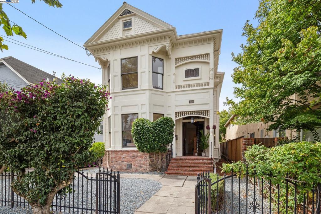 This unique Alameda property features two residences on one lot: a preserved 1895 Victorian and a mid-century duplex. The 2400-sf Victorian home captivates with original architectural details like a hand-carved staircase, soaring ceilings, ornate moldings, and decorative fireplaces. Its interior includes a light-filled living/dining area, an updated kitchen, and a media room, while the upstairs offers four bedrooms, two bathrooms, and a porch. Recent upgrades include a newly painted exterior, updated lighting, a Tesla charger, and updated electrical. Adjacent is a separate duplex with two updated 2-bed, 1-bath units. Both feature modern kitchens, new windows, in-unit laundry, and private storage. The duplex provides a substantial rental income of $5,400 monthly. Located in vibrant, historic Alameda, the property is close to top-tier schools, diverse shops, restaurants, Crown Memorial Beach, and offers easy transit to San Francisco via bus and ferry. This exceptional offering provides a rare blend of historical charm and a lucrative income stream, making it a unique investment.