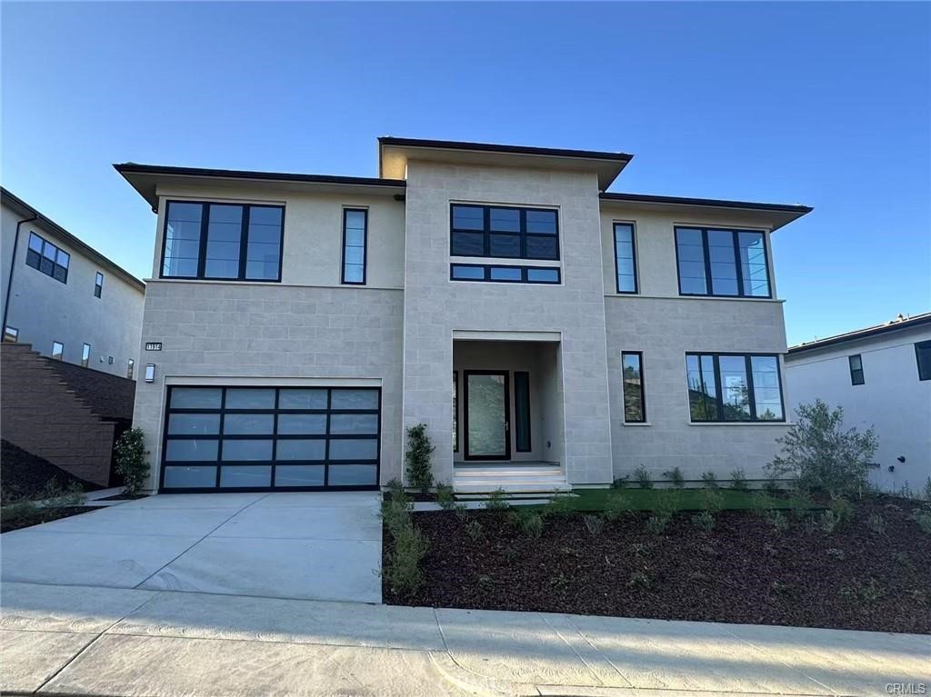 Discover the epitome of luxury living in the guard-gated haven of Westcliffe at Porter Ranch. This prestigious neighborhood offers breathtaking city light views and scenic mountain vistas, creating opulence. The expansive open floor plan, highlighted by a linear fireplace in the living room, exudes luxury every evening. From the grand design of the stairs to the glass-decorated landings, high ceilings, and recessed lighting, every detail speaks of quality. Abundant natural lighting fills each room, while the master suite offers spaciousness and a delightful bathroom featuring marbled flooring, a standing shower, a soaking tub, dual vanities, and a generously sized walk-in closet. The expansive backyard provides views into the beautiful community, offering the perfect backdrop for California sunsets. Convenience is at your doorstep with Whole Foods, a gas station, popular dining options, and entertainment all within close proximity. Top-rated schools further enhance the appeal of this distinguished community.