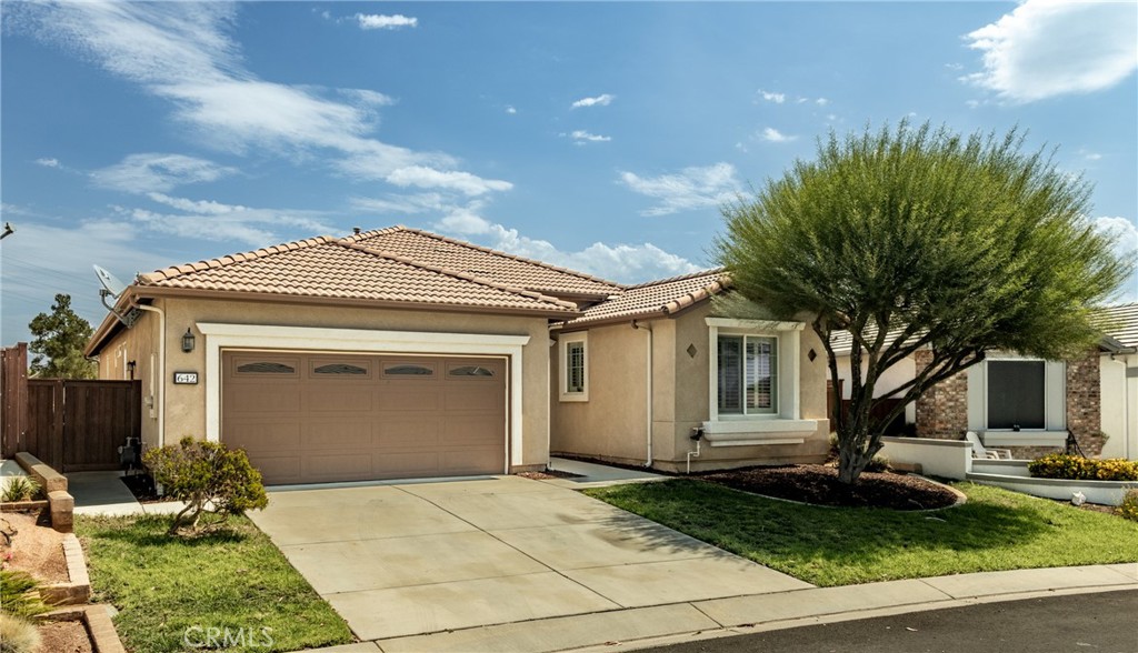 Check out this Invitational 3 home located on a cul-de-sac in the northeast corner of the gated and desired 55+ community of Four Seasons in Hemet. Beautiful home is located on an extra large 10,000+ sqft lot with no one behind and views of the mountains. 2 bedrooms, 2 bathrooms and an additional room that has double door entry and could be used as an office, den or craft room. Amazing kitchen with rich dark brown cabinetry, under cabinet lighting, granite countertops, stainless steel appliances, a long island and lots storage which opens up to the spacious living/dining room that has a fireplace and built-ins for your electronics. Large primary bedroom that has his/her closets right before entering it's bathroom with separate step-in shower & soaking tub, double sinks and a vanity. Inside laundry room with a sink and cabinets. Reasonable dues for all that the HOA has to offer - The Lodge clubhouse which has a Bistro, movie theater, gym, library, billiards, recreation & computer rooms, luxurious spa facilities, and a hair salon. Outdoor amenities include pool & spa, BBQ area, shuffleboard, tennis & pickleball courts, bocce ball, and many activities including occasional concerts under the stars. The community is within the Hemet Golf Club course, it's commuter friendly, close to shopping and much more.