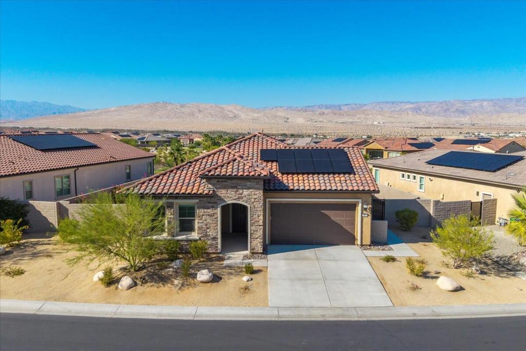 Open House Sat 9/20 12 Noon to 2 PM & Sun 9/21 12 Noon to 2 PM Welcome to resort-style living at its finest in the highly desirable Del Webb Rancho Mirage community. This beautifully appointed home combines elegance, functionality, and comfort, offering breathtaking panoramic mountain views that truly set it apart. Perfectly located in the heart of Rancho Mirage, the home is just minutes from premier shopping, fine dining, world-class golf, and top medical facilities, making everyday living both convenient and enjoyable. This residence features two spacious bedrooms along with a versatile den framed by French doors, ideal for a home office, library, or creative hobby space. An extended dining room and sunroom provide additional square footage and an abundance of natural light, creating warm and inviting spaces for entertaining or relaxing. The primary suite offers a peaceful retreat with a charming bay window, allowing you to enjoy serene mornings and stunning mountain vistas right from your bedroom. The chef's kitchen is the centerpiece of the home, featuring an executive island, upgraded appliances, and premium finishes designed to delight both casual cooks and culinary enthusiasts. The living room is thoughtfully designed with a built-in AV system for seamless entertainment. Throughout the home, additional upgrades such as a boot bench, floor outlet, soft water loop, gutters, and low-voltage wiring enhance comfort and convenience. Energy efficiency is at the forefront of this home's design. Owned solar panels paired with a flat-rate electricity plan deliver substantial savings, allowing you to enjoy modern living without the stress of fluctuating utility costs. Life at Del Webb Rancho Mirage is centered around an active, vibrant lifestyle. Residents enjoy exclusive access to an expansive resort-style clubhouse and state-of-the-art fitness center, along with tennis and pickleball courts, sparkling swimming pools and relaxing spas. A wide variety of social clubs, activities, and planned events provide endless opportunities to connect with neighbors and stay engaged. This is more than a home - it's a lifestyle destination. Whether you're relaxing with aglass of wine while taking in the stunning desert sunsets, or joining neighbors for afriendly pickleball match, you'll love everything Del Webb Rancho Mirage has to offer.Schedule your showing today and come see theVIEWS, the UPGRADES, and the unmatched LIFESTYLE waiting for you