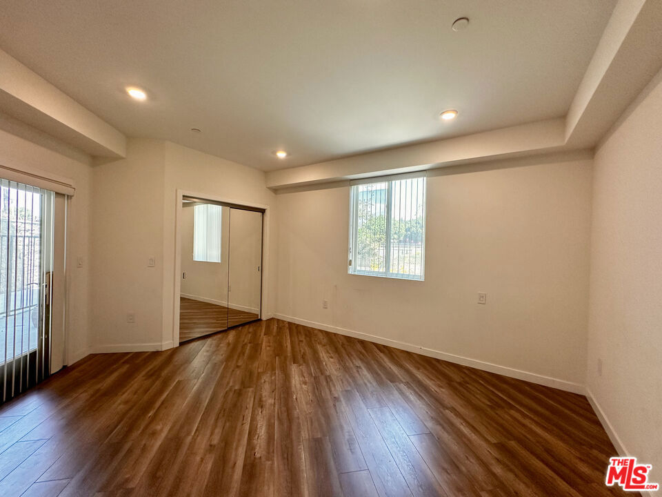 This bright and spacious 2-bedroom, 1-bathroom unit offers an open-concept layout with over 1,100 square feet of living space. Enjoy the seamless flow from the living area to the private balcony, accessible directly from the bedroom perfect for your morning coffee or evening unwind. The unit includes direct access from the garage straight into the home, adding convenience and privacy. Located in a prime Hollywood location near shops, dining, and transit. A rare opportunity to lease a well-sized unit in the heart of the city!
