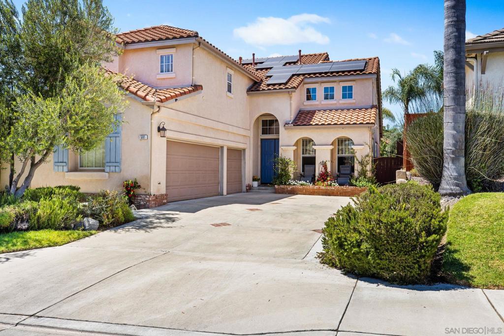 Located in the serene Twin Oaks neighborhood of San Marcos, this beautifully maintained home offers a versatile floor plan with both comfort and style. The main level features a formal living and dining room, as well as a cozy family room with a fireplace and vaulted ceilings. A main floor bedroom and full bath provide convenience for guests or multigenerational living. The beautifully appointed kitchen opens to the family room and features ample cabinetry, quality finishes, and a functional layout—perfect for entertaining. Upstairs, you’ll find the spacious primary suite with a walk-in closet and its own en-suite bath, along with the remaining bedrooms for added privacy. Step outside to a private backyard complete with a covered patio and low-maintenance landscaping, ideal for relaxing or hosting gatherings. Additional highlights include a solar system, whole-house fan, a 3-car garage with EV car charger, central A/C, and easy access to Highway 78 and Interstate 15. Enjoy nearby Twin Oaks Golf Course, parks, shopping, dining, and all that this desirable neighborhood has to offer.