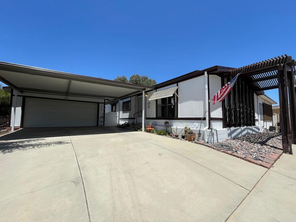 Assumable loan at 2.5% interest rate! Welcome to The Farm. This ideally located, single level home on an elevated lot is larger than most at .30 acres and offers both comfort and functionality. The property has recently undergone a refresh, featuring new exterior paint and carpet. As you arrive, you’ll immediately notice the covered parking in front of the expansive 20x30 ft garage, which includes a workshop in the back. With ample space for multiple vehicles, parking will never be an issue. A large shed behind the garage adds even more storage capacity. Inside, the open-concept living room provides a warm welcome and is perfect for entertaining or large family gatherings. The living area flows seamlessly into the formal dining space, complete with a built-in hutch, and a well-appointed kitchen with breakfast bar. The enclosed sunroom offers versatile living space that can be used as a home office, additional bedroom, craft room, or more — making the home feel even larger than its stated square footage. The generously sized laundry room includes extra storage, and the primary bedroom features a spacious walk-in closet for your convenience. Enjoy year-round comfort with central A/C powered by SOLAR, and rest easy knowing the roof was replaced in 2014. The Farm community offers a peaceful, amenity-rich lifestyle including, RV parking, multiple pools, tennis courts, basketball courts, playgrounds, walking trails, and fishing ponds. Don’t miss your opportunity to own this exceptional home in one of the area's most sought-after neighborhoods! Home qualifies for many types of financing including conventional, FHA and VA. This home has an assumable loan at a 2.5% rate.
