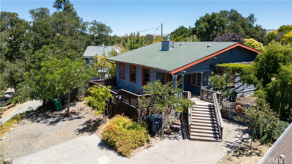 Charming 2-bedroom, 1.5-bath Colony Home featuring 1123 sq ft and built in 1925. A beautiful oak door with leaded glass opens to the living room updated with vinyl plank flooring and a cozy fireplace, flowing into a dining area with chandelier, built-in buffet, and a stylish half bath. The kitchen features newer cabinetry and counters, a farmhouse sink, double oven, and microwave. Both generous bedrooms include walk-in closets and share a bath with a classic clawfoot tub and a wall of self-closing cabinets and drawers. The laundry room offers pantry space and leads to a spacious backyard, ideal for gardening, entertaining, or relaxing. Enjoy morning coffee on the front deck, and make use of the side yard with a decorative gate for more garden potential. Leased solar system provides energy savings and efficiency. All with a country feel just minutes to downtown Atascadero’s restaurants, shopping, and Sunken Gardens events.