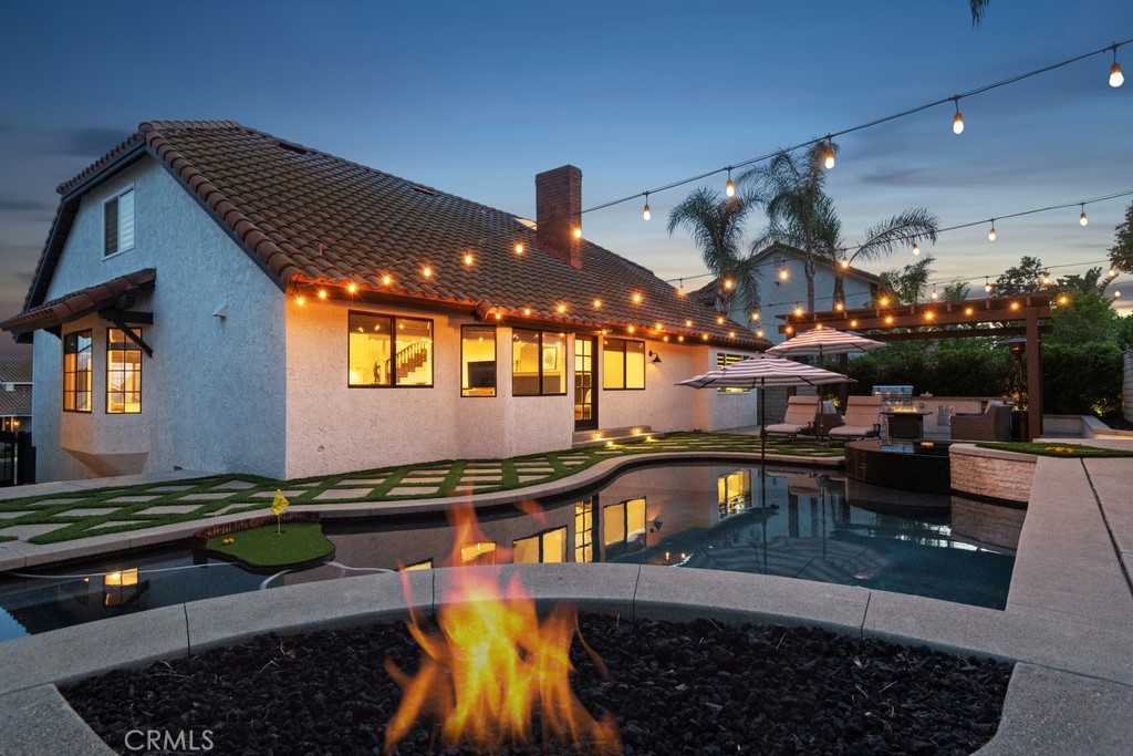 ~~LARGEST MODEL IN COMPASS ROSE~~Welcome to a truly magnificent custom home, impeccably designed, and move-in ready! Located in a highly sought-after North Rancho Cucamonga neighborhood this home offers panoramic city & mountain views, No HOA fees, and a gorgeous private Backyard Oasis! Spanning 2,811 sqft of living space with 3 bedrooms plus a Loft, and 3 bathrooms, as well as sitting on a 9,312 sqft Cul-De-Sac lot with an attached 3-Car Garage with epoxy flooring, built cabinets, bonus overhead storage area and there is also driveway RV Parking (an approximate 33-foot pad). The interior features beautiful engineered wood flooring, an abundance of natural light, and impressive high ceilings throughout. The formal living room, family room, and dining room are ideal for entertaining. The gourmet Chef's Kitchen showcases a large center island with extended breakfast bar seating, stunning countertops, cream colored cabinetry, and stainless steel appliances. The primary suite offers a spacious double closet and a private fireplace for ultimate comfort. The primary bathroom is a luxurious escape with its resort-style shower and Roman tub. There is also a versatile upstairs Loft space - perfect for a dedicated study, game room or private fitness area. Generously sized secondary bedrooms and a hall bathroom with dual sink vanity complete the upstairs. The impressive backyard is like a personal Resort, meticulously designed with a custom PebbleTec pool with Pentair pool equipment and a black infinity spa, a built-in firepit with seating, contemporary concrete and turf landscaping, on-trend bistro lighting, and a large covered pergola area with built-in BBQ bar - this space is an entertainer's dream! Experience the convenience of living close to desirable schools, including Los Osos High School, as well as shopping, dining, and quick access to the 210 Freeway. Schedule your private tour today!