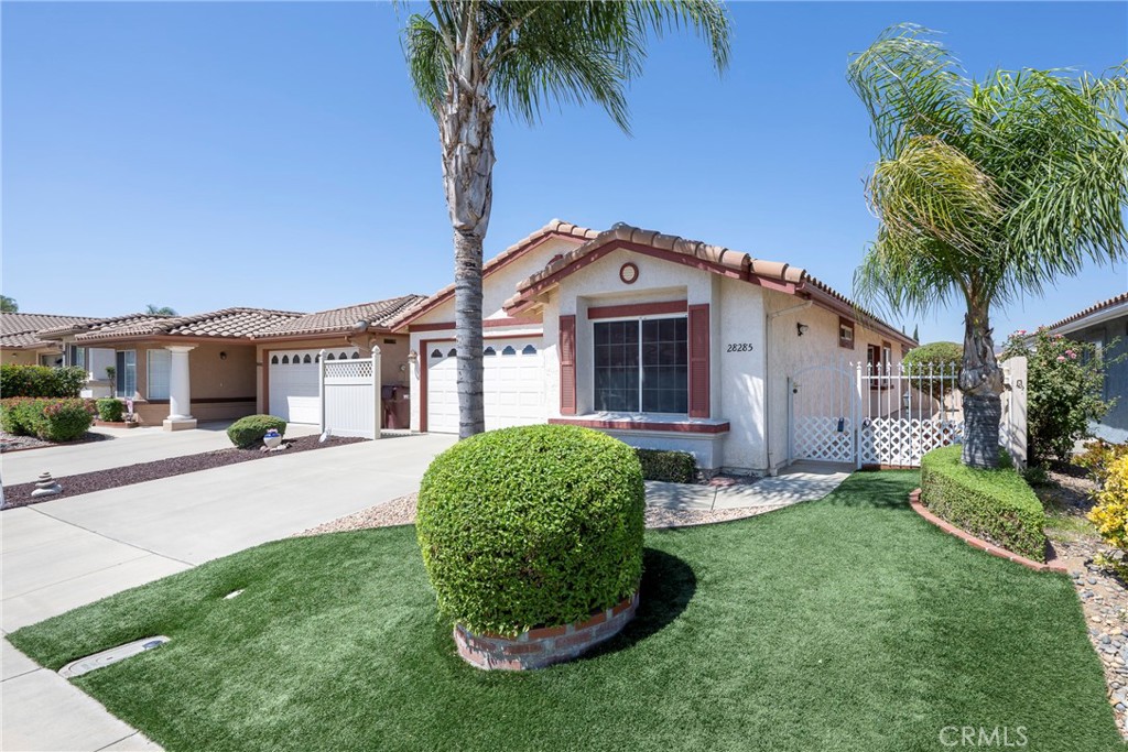 Highly desirable Lido floorplan in Menifee’s premier 55+ resort-style community, Casa Blanca. Located on a quiet street, inside the tract, this well designed home offers 2 bedrooms and 2 baths, including an ensuite primary bedroom, plus a versatile lanai ideal for relaxing, crafting, or a home office. Secondary bedroom features a built in wall desk area and has a bath adjacent.
Enjoy a low-maintenance lifestyle with realistic imitation turf in both front and rear yards. The two-car garage features built-in storage cabinets, pull-down attic access, and a convenient laundry area.
Community amenities are just a short walk away and include: Olympic-size pool & spa, Tennis and pickleball courts, Fitness center, and a Clubhouse for social gatherings
All this with a low monthly HOA fee. Live comfortably, maintain easily, and enjoy everything Casa Blanca has to offer.
