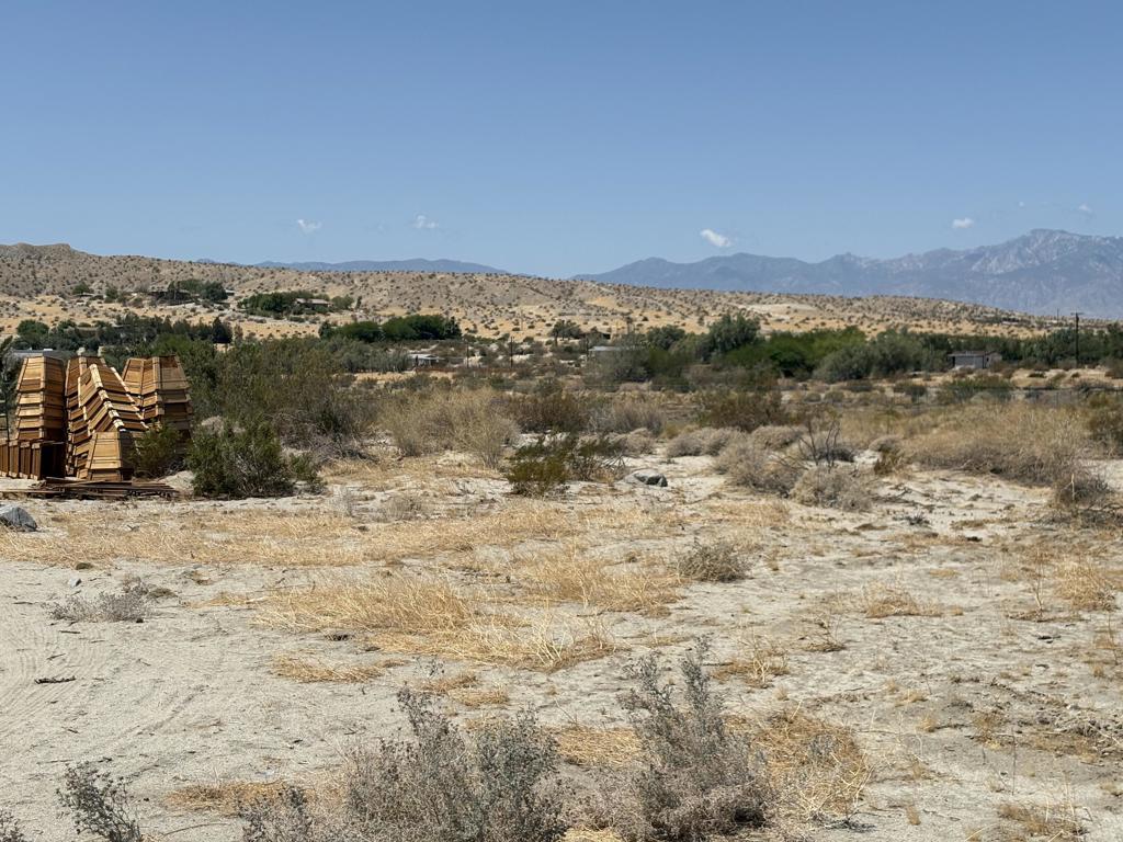 This flat and usable property located on Longvue Road in Desert Hot Springs (APN: 647-260-009) offers excellent infrastructure for agricultural or nursery-related use. The land features power and utilities at the street, along with an existing well and access to municipal water--though a meter installation is still needed. Included on-site are multiple 24x100 greenhouse frames (hoop houses), ideal for controlled plant cultivation, though nursery stock is not part of the sale. The property is fully fenced for security and includes an existing water system with pressure tanks and filtration. This is a ready-to-go site for operations seeking an agricultural base in a scenic desert setting with mountain views. ****No soils reports, surveys, etc., have been done. Buyer and buyer's agent to verify all information with the city or county for allowable uses and requirements and rely on their own investigations. **Buyer responsible for checking zoning, utilities, permits and exact property boundaries. ****