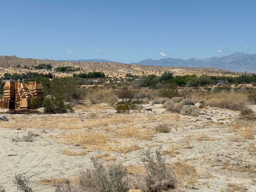 This flat and usable property located on Longvue Road in Desert Hot Springs (APN: 647-260-009) offers excellent infrastructure for agricultural or nursery-related use. The land features power and utilities at the street, along with an existing well and access to municipal water--though a meter installation is still needed. Included on-site are multiple 24x100 greenhouse frames (hoop houses), ideal for controlled plant cultivation, though nursery stock is not part of the sale. The property is fully fenced for security and includes an existing water system with pressure tanks and filtration. This is a ready-to-go site for operations seeking an agricultural base in a scenic desert setting with mountain views. ****No soils reports, surveys, etc., have been done. Buyer and buyer's agent to verify all information with the city or county for allowable uses and requirements  and rely on their own investigations. **Buyer responsible for checking zoning, utilities, permits and exact property boundaries. ****