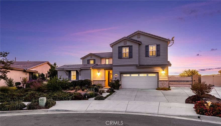 Perched high above the valley in the Citrus community, this hilltop home offers sweeping 180-degree views of mountains, rolling hills, and sparkling city lights. Situated at the end of a peaceful cul-de-sac, it blends comfort, style, and modern design for an exceptional living experience.

Inside are four spacious bedrooms, each with a walk-in closet and ensuite baths in both the guest suite and the elegant primary retreat. The primary suite includes a custom walk-in closet and a relaxing sitting area with a beautiful glass display wall designed to showcase personal collections.

The entertainer’s kitchen features GE stainless steel appliances, granite countertops, a custom backsplash, a walk-in pantry, and abundant cabinetry. It opens to a large family room with custom built-ins and glass pocket doors that extend the living space outdoors, creating seamless indoor and outdoor flow. A separate chef’s kitchen with a Wolf burner, steamer, grill, and wine refrigerator enhances the culinary experience. The formal dining room connects to a butler’s pantry with a second wine fridge, providing a smooth flow for gatherings. A downstairs office with dual desks features an ideal workspace, while the upstairs laundry room and versatile bonus room add everyday convenience. Throughout the home and detached casita, wood-grain tile flooring, plantation shutters, and custom shades highlight natural light and timeless elegance.