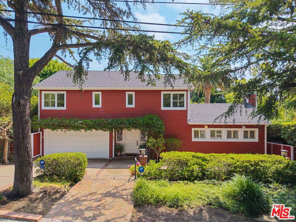 A truly rare offering in the heart of Brentwood, 604 S. Saltair Avenue presents nearly half an acre of usable land on one of the neighborhood's most desirable streets. Set on an expansive lot, this 5-bedroom, 7-bathroom home offers approximately 4,917 square feet of interior space, surrounded by mature trees, beautiful landscaping, and generous outdoor areas that create a true sense of space, privacy, and potential. Whether enjoyed as-is, updated over time, or reimagined entirely, this property delivers an opportunity that few others can match, combining scale, location, and versatility in a way that's increasingly rare in Brentwood. Properties of this size and setting are seldom available. Moments from Brentwood's top schools, shops, dining, and parks, this is a timeless piece of real estate that offers immediate livability with incredible room to grow.