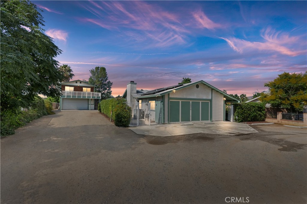 This is an amazing upgraded property for a multi-family or a business owner that needs space for a workshop/ storage or potentially rental units This property sits at the end of the street and includes a single-family residence with 3 bedrooms and a 4th-bedroom conversion. In the rear there is a separate entrance to an enormous 780 SF Garage with commercial roll up doors and the ADU with completely remodeled 4 bedroom living space with bathroom along with a lovely deck off two bedrooms. The main house has been completely remodeled and is in perfect condition. There is a large lot with fruit trees and extra space for adding pools gardens or? The total sf is 1762 main house and 830 sf. in ADU. So total sf is 2582 sf. This is a special property that has lots of opportunities for living or income producing. RV hook ups too!