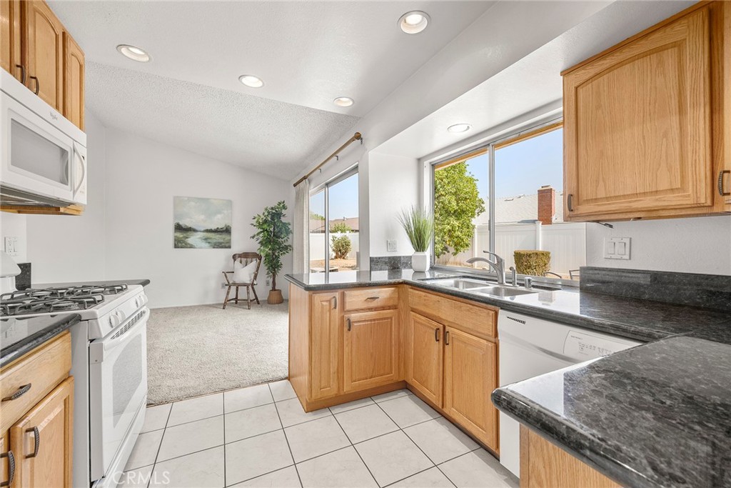 Welcome to 4035 Grimsby Lane, a charming single-story home located in one of Riverside’s most desirable neighborhoods. This well-maintained 4-bedroom, 2-bathroom residence offers 1,535 square feet of comfortable living space on a generous 7,405 square foot lot. From the moment you arrive, you’ll be greeted by a large front porch perfect for morning coffee or relaxing evenings and a double door entry that sets the tone for what’s inside. The interior features a warm, functional layout ideal for everyday living and entertaining. The open living and dining areas flow seamlessly into the kitchen, offering a welcoming space for gatherings. Over the years, thoughtful updates have been made, including an upgraded HVAC system to enhance comfort and efficiency. Step outside to a spacious, pool-sized backyard that’s brimming with potential ready for a future pool, garden, or custom outdoor living area. A large driveway and attached 2-car garage offer plenty of parking and storage. Located in a freeway-friendly area, this home provides easy access to shopping, dining, schools, and major commuter routes, all while being nestled in a quiet, established community. Don’t miss the chance to own this move-in-ready gem in a prime Riverside location with space to grow and make it your own.