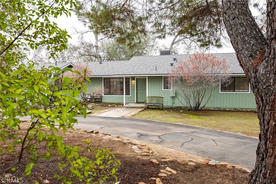 Welcome to charming and versatile living in Yosemite Lakes Park!

This well-designed home features 2 bedrooms + 2 bathrooms, plus a bonus room that works beautifully as an office or third bedroom. Step inside to a cozy living room warmed by a stylish pellet stoveideal for crisp mountain-air evenings. And don't forget to take in those mountain views! Outside, you'll discover a large backyard with space to park an RV or build a workshop, a fenced dog-run accessible from the back slider for your four-legged friend, and a circular driveway offering easy access and extra parking.
Located in the amenity-rich community of Yosemite Lakes Park, residents enjoy access to:
A clubhouse and restaurant/lounge
A swimming pool area and tennis courts
A golf course, equestrian center and scenic recreational trails
yosemitelakespark.org

Don't miss this rare opportunity to live where comfort meets recreationschedule a showing today!