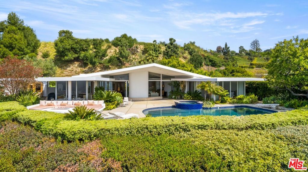 Restored Trousdale mid-century masterpiece hovering on a promontory with massive unobstructed city to ocean views. Soaring A-frame high ceilings, wonderful open floor plan with great proportions, and one of the best views in Trousdale. On one of the most exclusive and quiet streets, Haynes. Secured, private, and a very peaceful setting. Trousdale has a rare few gems, and an architectural marvel like this comes up once in a lifetime. By architect David Hyun, who designed the famous Japanese Village Plaza in Little Tokyo and worked with Schindler and Neutra. Here is your chance to own a piece of history in the number one location in all of Los Angeles. Opportunities like this very rarely come available.