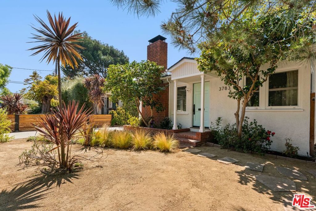 This recently updated residence combines modern upgrades with timeless California charm in one of Mar Vista's most coveted pockets.The main house features 2 bedrooms and 2 full baths, both rooms are spacious with sliding doors. Bright living and dining area are anchored by hardwood floors and an indoor fireplace, creating a warm and inviting flow. The kitchen comes equipped with stainless steel appliances and dining room to create a cozy dining space. The 256sf detached bonus room with half bath offers flexibility for a home office or creative studio. Additional highlights include a large detached two-car garage and a long driveway with ample parking. Upgrades include a drought-tolerant landscaped yard, newly exterior paint and interior paint. Ideally located near Mar Vista's popular restaurants, farmers market, local shops, and transit, with Venice Beach just minutes away and situated within the sought-after Beethoven Elementary School district.