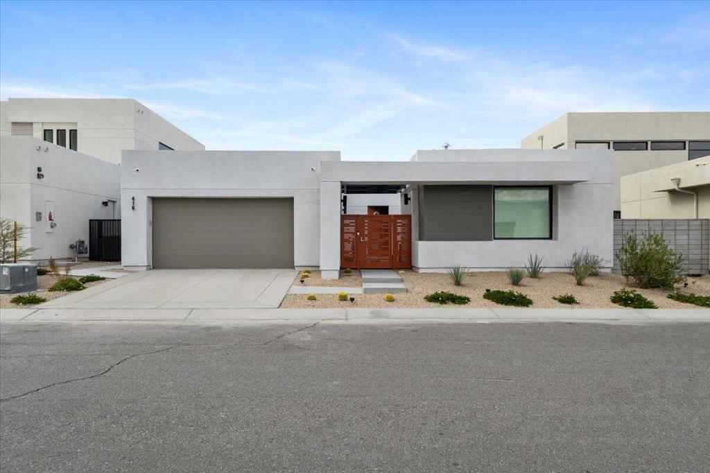 Located in the gated community of Miralon in Palm Springs, this modern home offers resort-style living with a spacious open-concept design, tile floors throughout, and expansive mountain views. The primary suite includes an en-suite bathroom with a walk-in shower and dual vanities.The kitchen is equipped with high-end appliances, a large pantry, and an oversized island, opening to the great room with a sliding glass wall for seamless indoor-outdoor living. Each bedroom provides direct access to the yard, creating a strong connection between indoor and outdoor spaces.The backyard is designed for relaxation and entertaining, featuring a covered patio, pool, and spa.Residents of Miralon enjoy a variety of amenities, including heated pools, a spa, fitness center with Peloton bikes, yoga studio, bocce courts, U-pick gardens, dog parks, a community chef's kitchen, and an on-site cafe and bar. Conveniently located near downtown Palm Springs and major highways, this home combines comfort, luxury, and accessibility.
