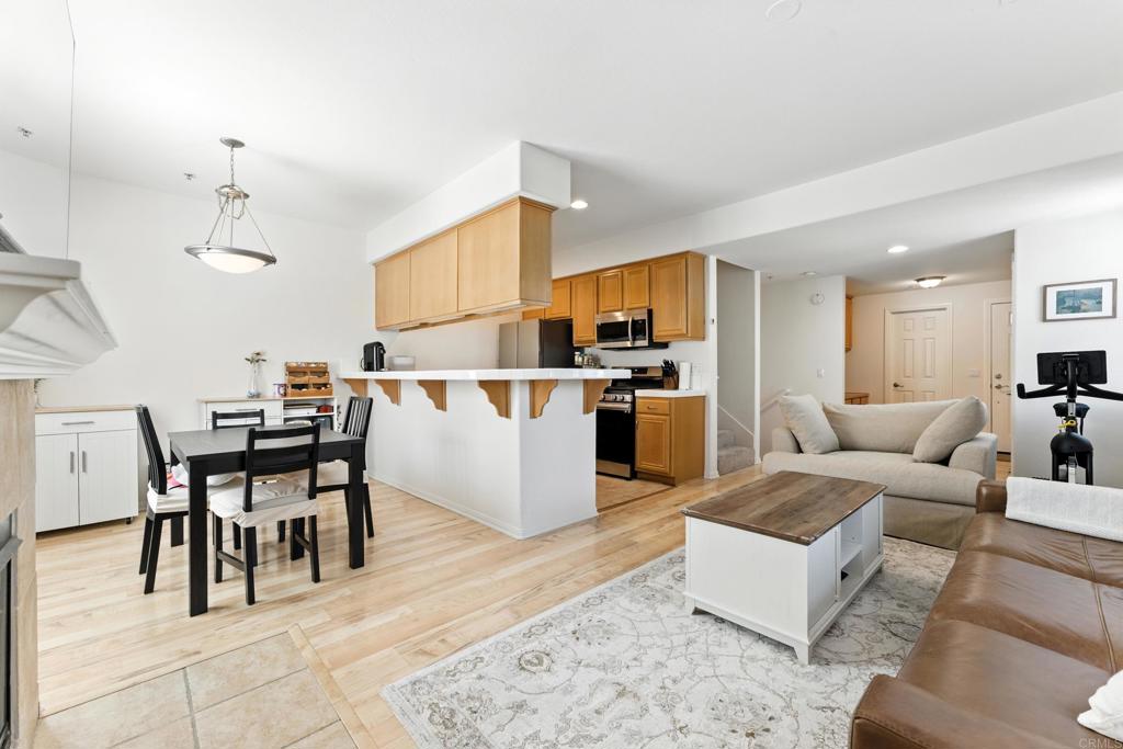 Welcome to your sought-after, light and bright corner unit townhome nestled in the heart of Sabre Springs. This thoughtfully maintained home offers the perfect balance of comfort, style, and convenience. Step inside and feel right at home with this intuitive floorplan with ready, built-in work from home/desk space with ample storage and open-concept living and dining area. The spacious living room features a cozy fireplace and large windows that flood the space with natural light. Upstairs, the expansive primary suite boasts a huge walk-in closet and ensuite bathroom with dual sinks and a soaking tub as well as an extra large slider that opens up to your private balcony. Two additional bedrooms share a full hall bath and conveniently located upstairs laundry adds to the ease of living. The attached 2-car garage with direct entry makes this townhome lives like a house. The community pool and spa area features stainless steel gas BBQ, tables and chaise lounges for complete poolside enjoyment. Located in the award-winning Poway Unified School District. Enjoy easy access to I-15, nearby shopping, dining, parks, and hiking trails. Whether you're a first-time buyer, downsizing, or simply looking for a low-maintenance lifestyle in a desirable location—this townhome checks all the boxes.