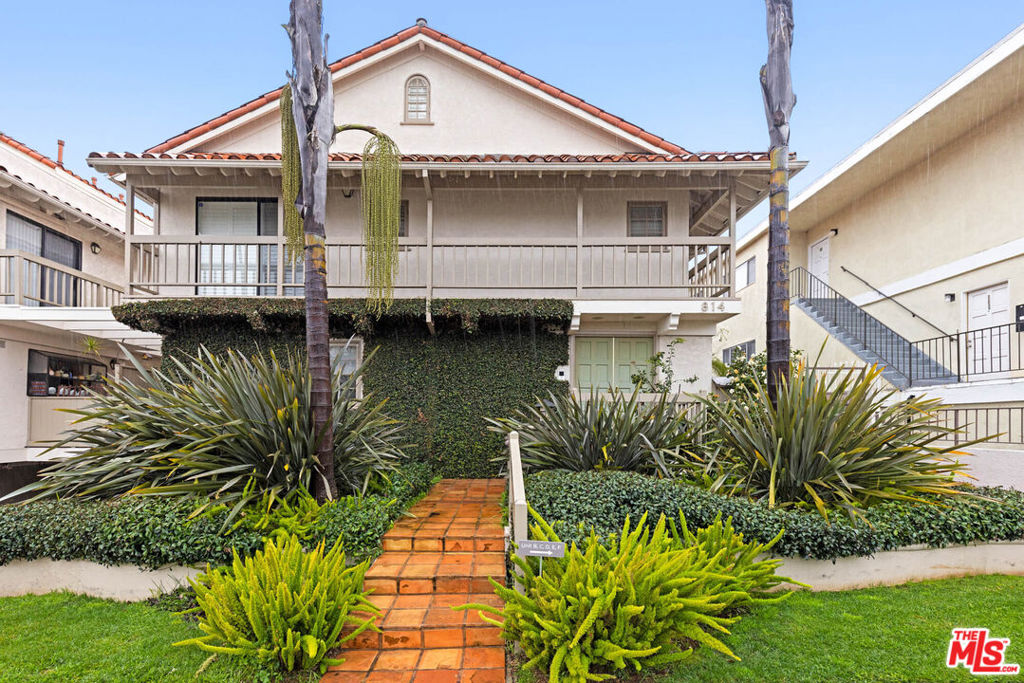 Situated in one of Santa Monica's most highly sought-after neighborhoods set on a premier, palm-tree-lined street, this stunning, recently renovated 2BR/3BA end-unit townhome with loft, private roof deck, basement, and direct-access two-car private garage offers the perfect balance of style, comfort, and coastal living. Step inside to find beautiful wide-plank oak hardwood floors, quality newly installed windows throughout, and abundant natural light. The modern kitchen has been completely remodeled, featuring sleek cabinetry and stainless-steel appliances, and includes a delightful garden window - a sunlit showcase perfect for fresh herbs, potted plants, or a touch of natural beauty to brighten the heart of the home. The living area is anchored by a beautiful updated decorative fireplace, while the largest side patio in the building creates a seamless indoor-outdoor flow, ideal for al fresco dining, entertaining, or simply relaxing under the Santa Monica sky. Upstairs, the primary suite impresses with soaring vaulted ceilings, two fully customized closets designed by California Closets, and a spa-like designer luxury bathroom, complete with heated towel hanger. The versatile loft space works beautifully as a home office, library, playroom, or creative studio, while the basement serves as a flexible bonus room perfect for a gym, media room, guest area, or private retreat. Three private outdoor spaces, including a sunset-view roof deck, allow you to savor ocean breezes and golden-hour views. Additional highlights include an in-unit laundry area, ample storage throughout, and a private underground garage with direct entry to the home. All bathrooms including powder room, each meticulously designed with chic, contemporary finishes and artisanal touches, evoke the ambiance of a boutique luxury hotel. Enjoy unbeatable location and close proximity to coffee and juice shops, chic boutiques, and renowned cafes and restaurants, and the Santa Monica bluffs, along with access to award-winning Franklin Elementary and Lincoln Middle School districts. Turnkey and thoughtfully upgraded with every detail carefully considered, be prepared to cherish this healthy lifestyle and exclusive living.