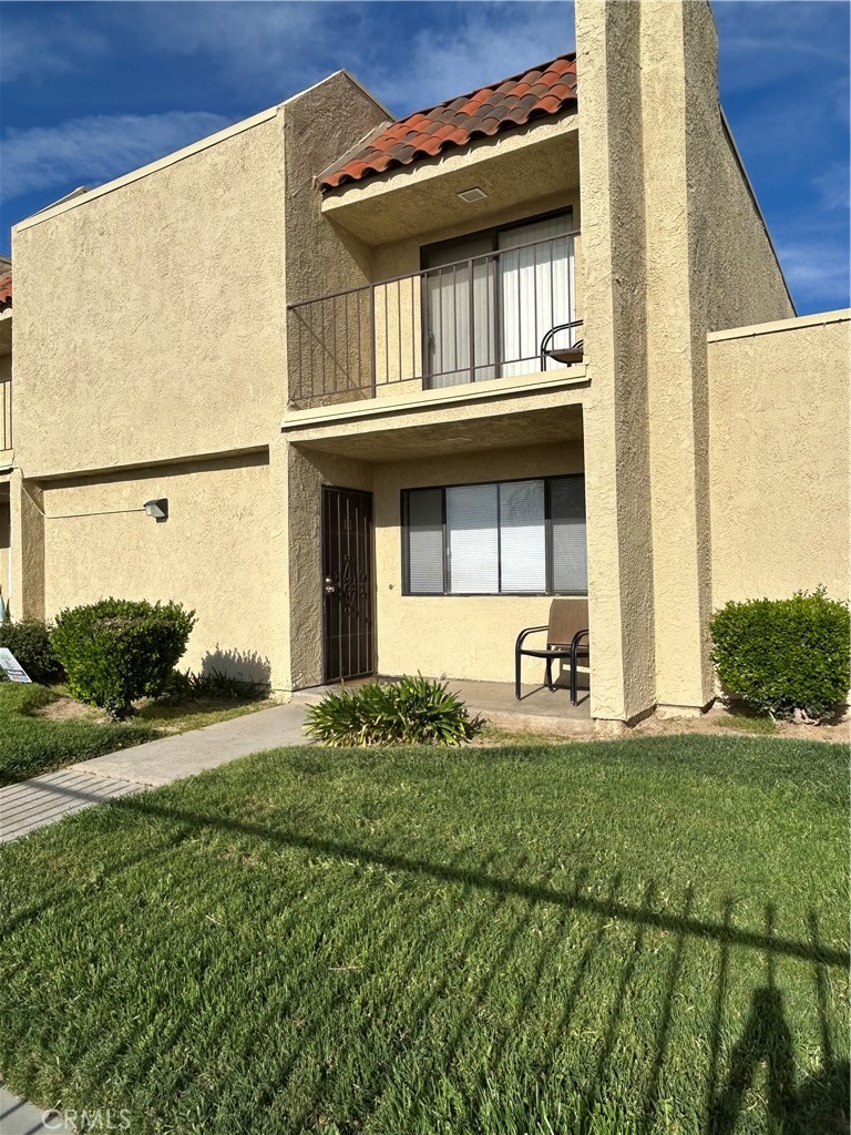 Townhouse! **conveniently located in walking distance to schools, shopping, restaurants and medical facilities. Two bedrooms upstairs, one bedroom has a balcony. Downstairs has a living room with a fireplace, dining room, spacious kitchen and indoor laundry. There is an atrium that provides indoor/outdoor living and lots of natural light. 2 car attached garage with direct access to the house.