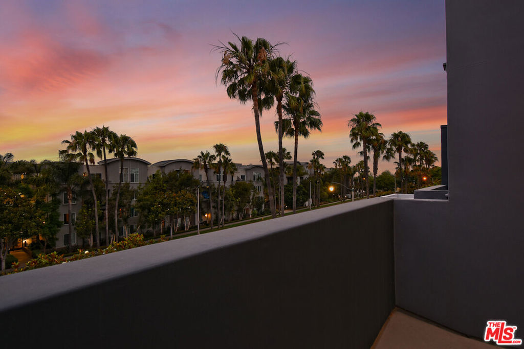 Welcome to your very Chic & Modern townhome at Silicon Beach! This rare contemporary loft-style home is tucked into one of the most sought-after communities at Bridgeway Mills in Playa Vista. You are greeted by the lush landscape and beautifully maintained grounds. The charming private front entrance opens to towering ceilings and expansive windows, allowing a sun-drenched floor plan that is filled with natural lighting. The expansive living and dining areas flow effortlessly, creating a perfect setting for entertaining or relaxing in style. The chef's kitchen is outfitted with stainless steel appliances, generous counter space, and plenty of cabinetry, offering both style and function for home chefs and guests alike. The elegant and open floor plan allows for entertaining onto your private and generous sized patio, perfect for BBQs and dining al fresco. Upstairs, your expansive loft awaits you and is ideal as a home office, guest space or both. The second floor is graced with the loft and 2nd bedroom. This floor allows for an additional bathroom with shower and perfect for guests. The loft is completed with gorgeous treetop views and access to your own private balcony. After a days work, step up to your top floor sanctuary. This full floor private primary suite feels like a luxe hotel hideaway, offering serenity and comfort. Step onto plush carpeting, tall ceilings , and a spa-like ensuite bathroom with a large soaking tub, separate glass shower, and a spacious walk-in closet. Step outside to yet another private balcony, perfect for catching golden-hour sunsets and soaking in the greenery and nature filled Playa Vista atmosphere. If you must leave, enjoy the convenience of your own direct access to your private garage with laundry area and generous storage space. If you are lucky to live here you will also have access to the resort-style amenities: top-tier fitness centers, pools, local parks, movie theaters, trendy restaurants, and boutique shopping. Even your dog will have their own community dog park! The beauty of this oasis is that it in centrally located to all the Westside has to offer. You are minutes to LAX, boating in the Marina ,Loyola Marymount University, Venice, and the most gorgeous beaches Southern California has to Offer.