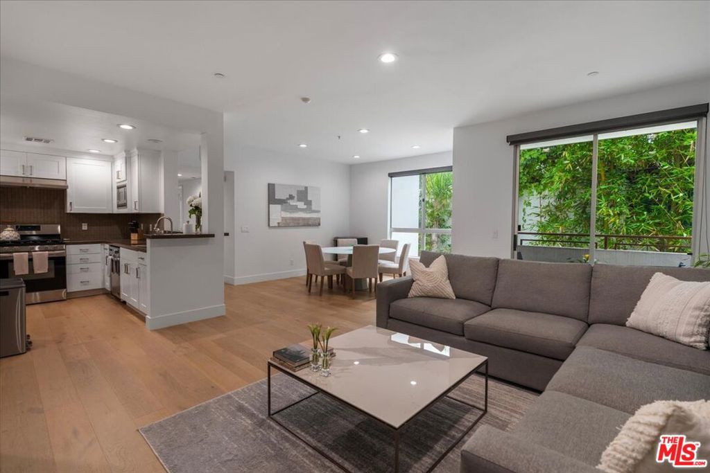 Designer-done and fully updated, this private 2-bedroom, 2.5-bath back corner unit offers a rare blend of modern style and everyday comfort in the heart of Century City. With updated French white oak floors, fresh paint, new LED lighting, and thoughtfully refinished kitchen cabinetry with sleek new sink hardware and faucets, every detail has been curated for a contemporary look and feel. The open layout is framed by oversized windows and a tranquil balcony overlooking mature bamboo, flooding the home with natural light and greenery. The kitchen features quartz countertops, stainless steel appliances, and a breakfast bar, while the living area provides a great entertainment space. Both bedrooms are en suite, with the primary offering a generous walk-in closet. Upgrades extend beyond the interiors: the balcony deck has been refinished, the roof was resealed in 2023, and a new ButterflyMX intercom provides secure guest access from both the front entry and garage. Residents enjoy the convenience of in-unit laundry, two tandem parking spaces along with a storage locker, plentiful guest parking, and the benefit of 7 newly installed EV chargers in the building. Just moments from Century City Mall, UCLA, Beverly Hills, and major freeways, this move-in-ready home combines luxury, convenience, and peace of mind in one exceptional package.
