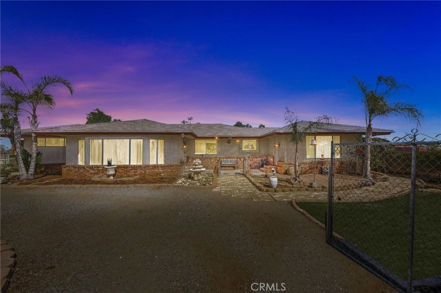 For Sale – Versatile 5-Bedroom Home on 1 Acre in Perris

* Bedrooms: 5

* Bathrooms: 3

* Lot Size: 43,560 sq ft (1 acre)



Discover this beautifully maintained single-story home offering space, flexibility, and income potential—all set on a full acre of usable land in a quiet, accessible neighborhood.



This stunning home boasts a charming brick and stucco exterior with fantastic curb appeal. The front yard is beautifully landscaped with palm trees, stone planters, artificial turf, and a paved walkway. Inside, the open-concept living area features wood laminate flooring and a cozy brick fireplace. The gourmet kitchen shines with granite countertops, rich wood cabinetry, and stainless steel appliances. With two spacious primary suites, it’s perfect for multi-generational living. The converted garage ADU offers 2 bedrooms, 1 bathroom, and a full kitchen, ideal for rental income or extended family. An additional JADU, complete with its own kitchen and bathroom, adds even more flexibility. The gravel driveway provides ample parking for vehicles, trailers, or recreational equipment. Plus, the property is zoned for horses—perfect for fulfilling your equestrian dreams!

This property is being sold AS IS and offers incredible potential for customization, expansion, or income generation. Buyer to verify all permits and city requirements.

Whether you're an investor, homeowner, or multi-generational buyer, this property checks all the boxes for space, versatility, and long-term value.