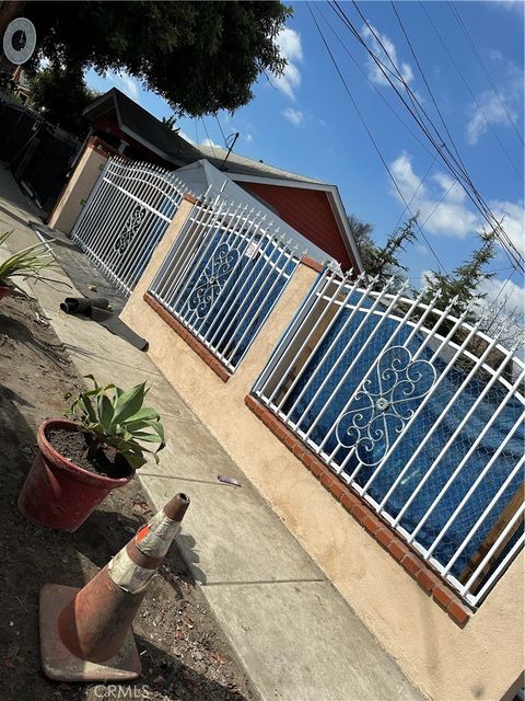 Photo of 661 W 65th Street, Los Angeles, CA 90044 (MLS # DW23124662)