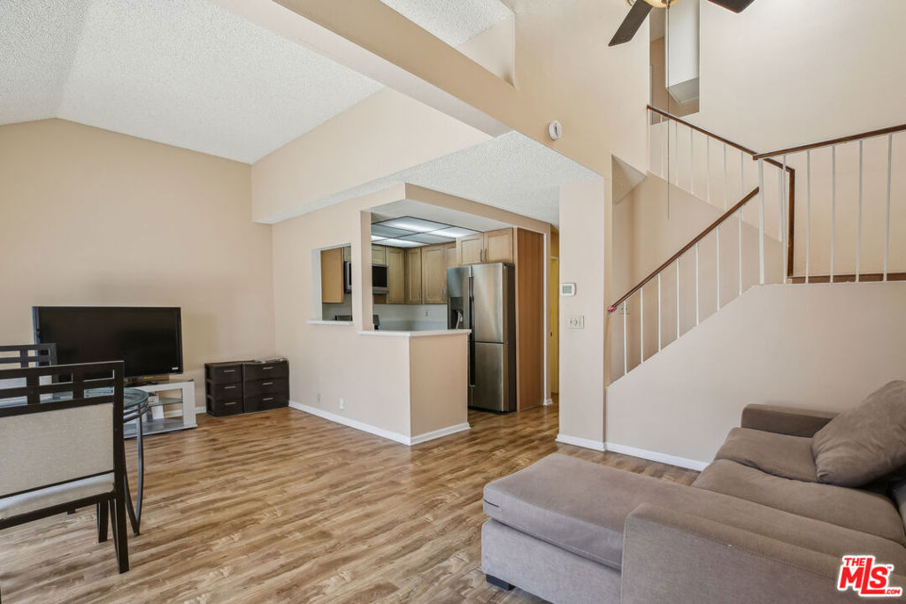 Welcome to this beautifully renovated 2-bedroom, 2.5-bathroom townhouse located in the well-maintained, gated community of Wellington Landing. The home features a fully remodeled kitchen with brand new stainless steel appliances. All bathrooms have been thoughtfully updated with new sink vanities for a fresh and modern feel. The main level offers a spacious living room with a cozy fireplace, an enclosed patio, a convenient half bathroom, and an attached garage providing secure parking and additional storage. Upstairs, you'll find two generously sized bedrooms, each with its own private en-suite bathroom. Situated just minutes from parks, schools, and major freeways.