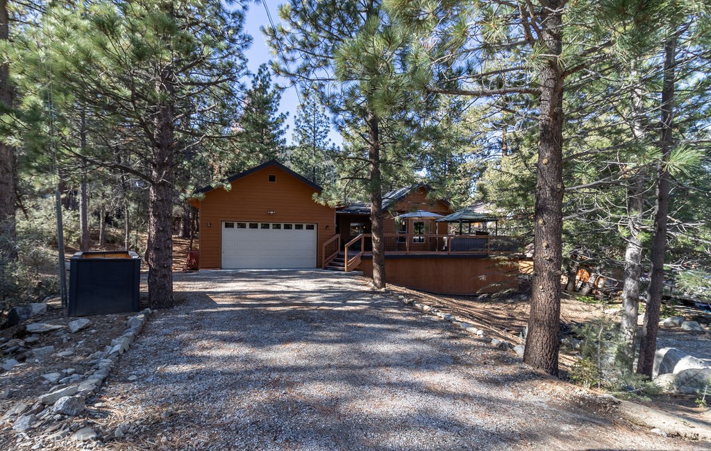 A spacious, 2019-built one-story home with a large deck, 3 bedrooms, 2 baths and a 2-car garage with electric charger and direct access into the house is available now in Pine Mountain Club! Enjoy this newer home with a huge great room with plenty of space for seating and dining as well as an open modern kitchen with an island. Entertain friends and family here and on the front deck as well with view of the mountains and the pines.
The primary suite features a walk-in closet and a bathroom with double vanity and step-in shower as well as a private room for the commode. The guest hallway bathroom has a shower over tub and a vanity with storage. Central heat and a a pellet stove offer options for convenient and cost-effective warmth with a cozy atmosphere.
A gracious mountain home with modern conveniences can be yours! Make an appointment today to see this beauty.