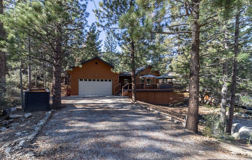 A spacious, 2019-built one-story home with a large deck, 3 bedrooms, 2 baths and a 2-car garage with electric charger and direct access into the house is available now in Pine Mountain Club! Enjoy this newer home with a huge great room with plenty of space for seating and dining as well as an open modern kitchen with an island. Entertain friends and family here and on the front deck as well with view of the mountains and the pines.

The primary suite features a walk-in closet and a bathroom with double vanity and step-in shower as well as a private room for the commode. The guest hallway bathroom has a shower over tub and a vanity with storage. Central heat and a a pellet stove offer options for convenient and cost-effective warmth with a cozy atmosphere.



A gracious mountain home with modern conveniences can be yours! Make an appointment today to see this beauty.