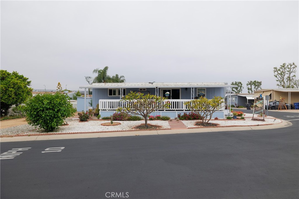 This beautiful 2 bed 2 bath home with central air and heat sits on a huge corner lot with gorgeous mountain views. Newer dual paned windows throughout! This home is in a beautiful resort like senior community with a large community clubhouse, fitness center, billiard room and much more! This home features a large fenced, covered porch and 2 sheds for lots of extra space at a great price. You must see this one!