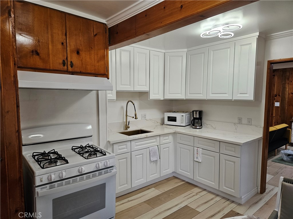 Stylishly renovated two-story cabin nestled in a quiet neighborhood, offering a spacious, well-designed layout. Features include brand-new flooring, freshly painted interiors, and a modern kitchen upgrade. Exceptionally accessible location for convenience and ease. Furniture negotiable—move in and make it yours.
