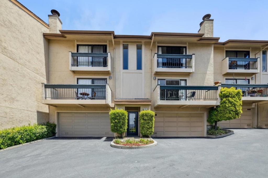 Nestled in the desirable Stonegate community, this 3-bedroom, 2.5-bath townhouse offers a rare blend of scenic tranquility and urban accessibility. Perched on a peaceful hillside, the home features stunning panoramic views from the main living level, where large windows flood the open-concept living and dining areas with natural light. A cozy fireplace and classic kitchen complete the inviting space. Upstairs, the spacious primary suite boasts a private balcony with serene views and a large closet, offering a perfect retreat. Two additional bedrooms, a full bath, and laundry complete the upper level. Enjoy the convenience of a two-car garage with ample storage, all while being just minutes from top-rated schools, parks, SFO, and a variety of shopping and dining options. Experience the best of Bay Area living peaceful, connected, and elevated. Don't just live in the Bay, live above it.