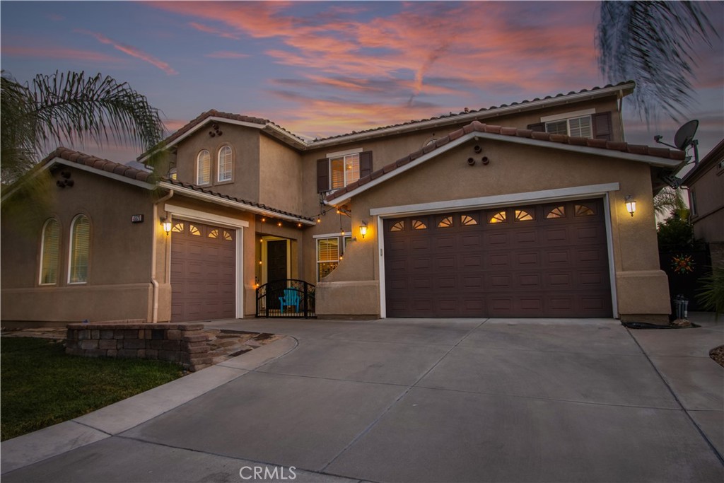 Stunning pool home located in the highly sought-after Wolf Creek community in South Temecula that just became available. This residence boasts an exceptional open and well-designed floor plan, welcoming you through a charming gated courtyard. The interior has been freshly painted and features elegant custom wood shutters throughout, complemented by a combination of hardwood and laminate flooring. For added convenience, there's a full bedroom and a full bathroom with a walk-in shower conveniently located downstairs. The home offers distinct living spaces, including a formal dining room and a spacious living room. The heart of the home is the large chef's gourmet kitchen, complete with a custom-built island seating area, stainless steel double ovens with a warmer drawer, and a large range stovetop with a hood. This kitchen seamlessly flows into a large family room, featuring a cozy fireplace and a custom-built entertainment center. Upstairs, you'll find a dedicated tech center office area and four additional bedrooms, each equipped with ceiling fans. The grand master bedroom is a true retreat, offering his-and-hers walk-in closets, a large master bath with a walk-in shower, and a large soaking tub. The seller has enhanced the ambiance with upgraded recessed lighting throughout the entire home, all on dimmers.
The tropical landscaped backyard is a true oasis, perfect for entertaining with its mountain views and no rear neighbors, ensuring ultimate privacy. You can relax under the fully enclosed alumawood patio cover, which includes lighting and two ceiling fans. The spacious backyard features a grassy area and a fully fenced saltwater pool and spa. The garages are thoughtfully designed with cabinets and added industrial lighting. Furthermore, the home is equipped with a Culligan whole-house soft water and filtration system, providing a superior living experience. This property is situated in a fantastic community with top-rated schools and is truly ready for its new owners to move in and enjoy.