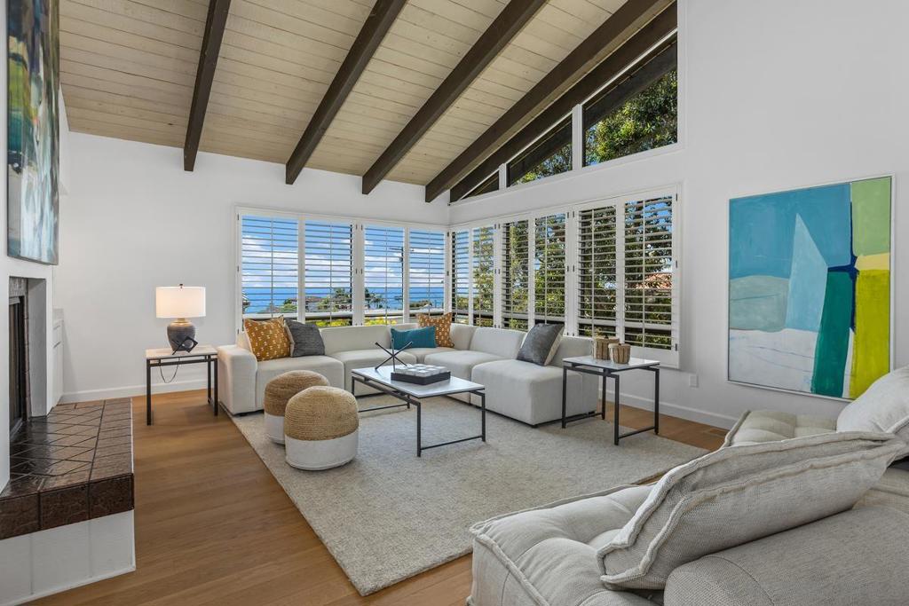 Dramatic contemporary home with water views, steps to the Pacific Ocean. 4 bedroom, 3 bath residence with soaring ceilings and expansive walls of glass that offers extraordinary privacy and serenity in the heart of the Beach Barber tract. Features include completely updated cook's kitchen with a Miele steam oven and quartz countertops throughout, including all three bathrooms, custom hardwood floors, window coverings, premium decking, detached 2 car garage and a lovely private garden. Offered for the first time in over three decades -- a rare opportunity not to be missed! Easy to walk, bike ride to La Jolla Village, Bird Rock Village, shops, restaurants, dog park, and the beaches of Little Point, famed Wind 'n Sea, and the year round beaches and sunsets of La Jolla.