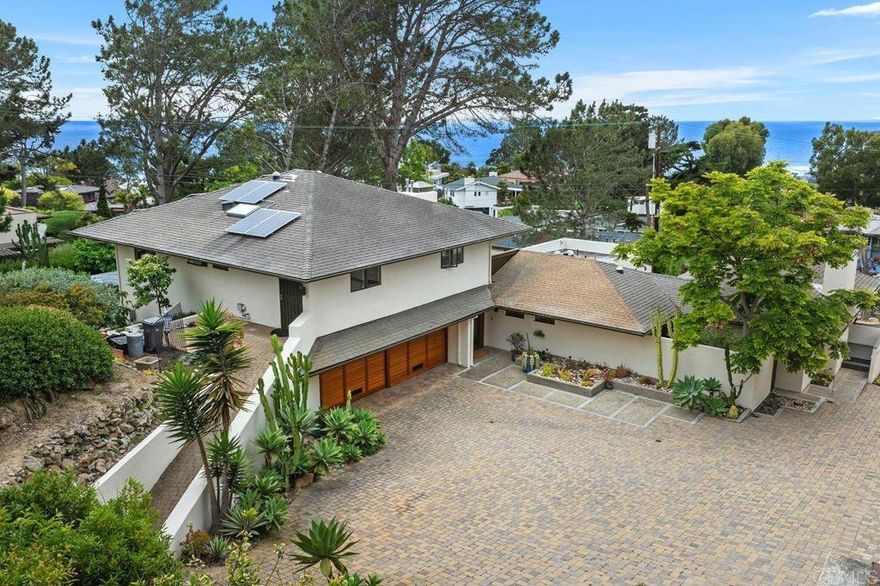 Guest House is included! Mid-term or long term rental available, fully furnished or unfurnished, price will vary depending on the terms and duration.  Also available separately as main home only for $17,000 per month or 1bd/1bth guest home only for $4,000 per month at lower price. One of the most prestigous homes of Olde Del Mar-Panoramic white water ocean view.  An architectural masterpiece designed by the renowned Mid-Century Modern visionary John Lloyd Wright, this extraordinary estate epitomizes coastal elegance and sophisticated living. Nestled atop one of the most expansive and prestigious parcels in Olde Del Mar, this remarkable residence offers breathtaking panoramic ocean vistas stretching from the pristine shores of Del Mar Beaches to the iconic cliffs of La Jolla.  This property is a testament to Wright’s genius, boasting his signature ceiling designs, an awe-inspiring spiral staircase that flows effortlessly through the home, and an original stained-glass entrance feature that sets the tone for refined luxury. The expansive basement adds to the grandeur, complementing the four-bedroom, four-bathroom layout. The primary suite, located on the main level, exudes tranquility, while an additional family room on the upper floor provides an ideal retreat. Thoughtfully designed with accessibility in mind, a wheelchair-friendly pathway leads seamlessly from the driveway to the second-floor bedroom. Includes solar panels, washer, dryer, refregerator, AC, Sauna in the master bathroom, this property is addressed to attend  award-winning Del Mar Union and San Dieguito Union School District, and an ambiance of exclusivity, this estate presents a rare opportunity to rent  a piece of historical luxury—a retreat where the symphony of the ocean waves becomes the soundtrack to everyday life.