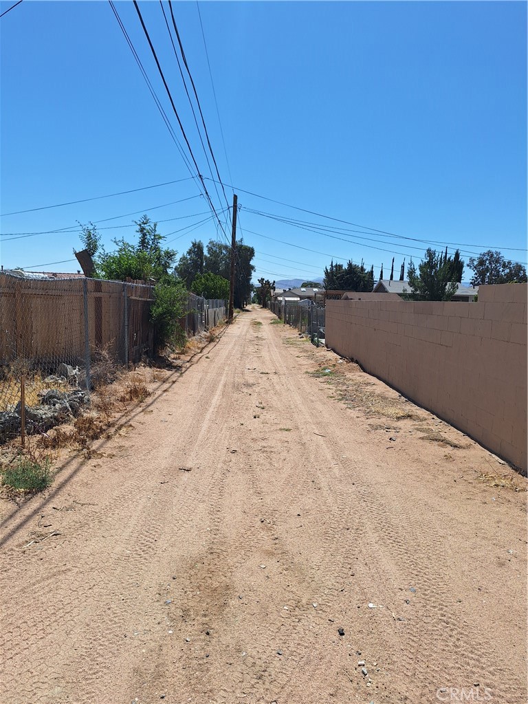 Situated in the rapidly developing High Desert area of Hesperia, CA, this prime vacant lot offers immense potential zoned Residential & Mixed-Use. Ideally located near the 15 Freeway and surrounded by highly-rated schools, popular restaurants, shopping, and community amenities, this parcel is at the heart of a promising growth corridor. Many large projects are in the works coming to the High Desert including the exciting addition of Brightline West’s all-electric high-speed rail, set to connect Las Vegas with California through stations in Apple Valley, Hesperia, and Rancho Cucamonga, this location stands poised for future prosperity and increased accessibility. Utilities are located near the property. The Mixed-Use zoning provides flexibility and potential for a range of uses, making it perfect for those looking to invest in an area with residential charm and commercial possibilities. This zoning encourages single-family residences.